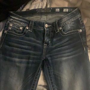 Miss Me low rise boot cut jeans in a size 26